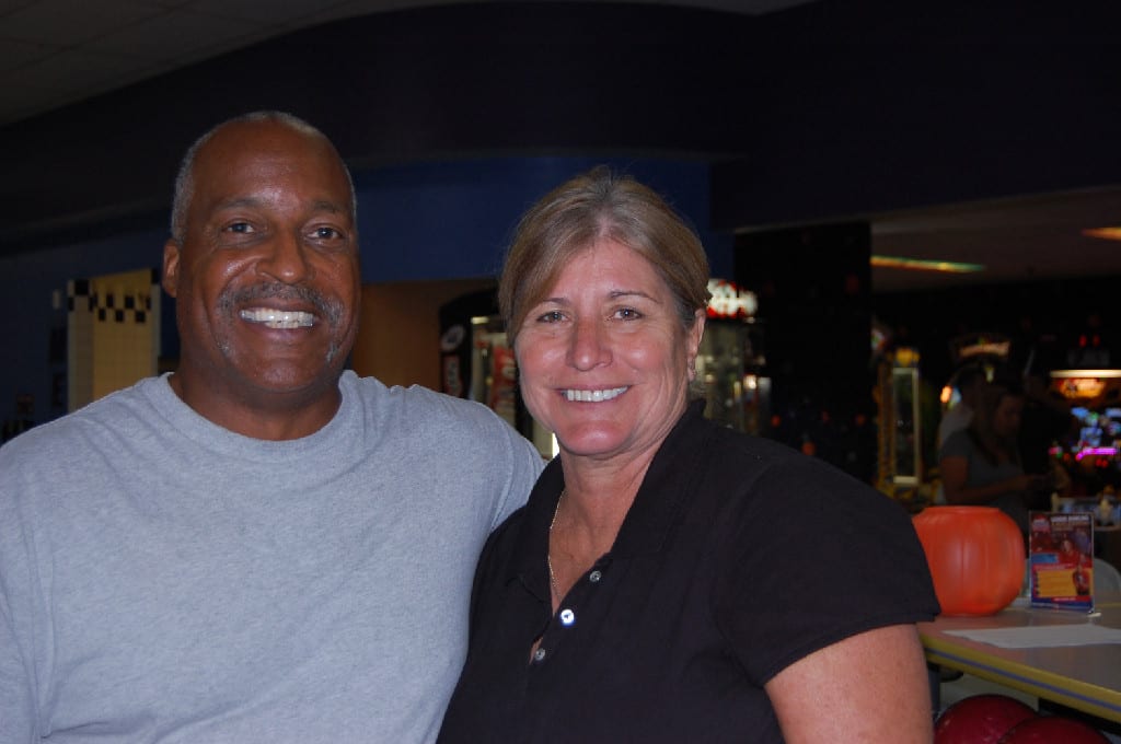 A Man and Woman Smiling and Posing for Photoshoot