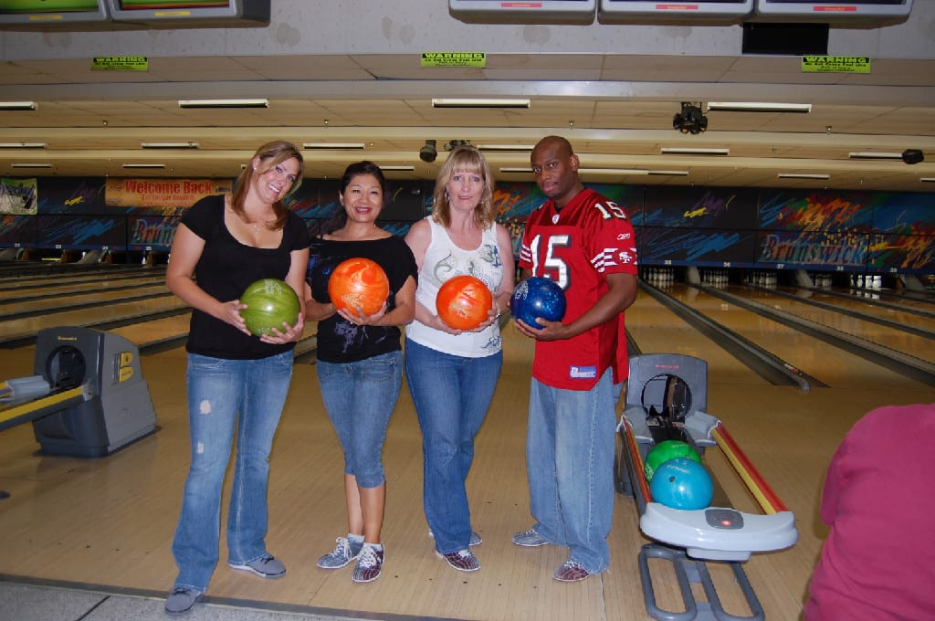Three Women and A Man with Bowls in Hand for Photo Session