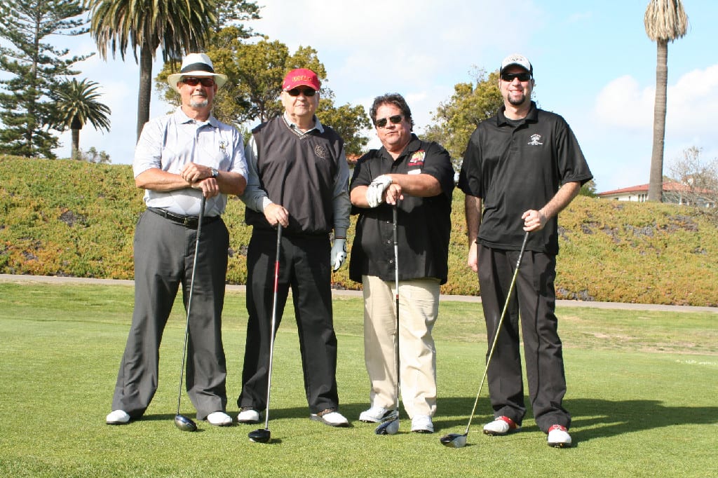 Team of Four Golfers with Clubs Photographed on the Course