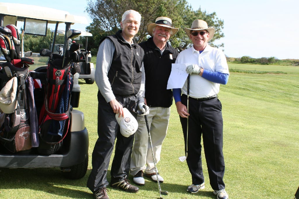 Three Senior Golfers with Clubs, Golf Kits, and Carts