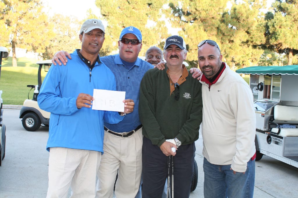 A Group of Golfers at the Annual Golf Tournament Posing for Photograph